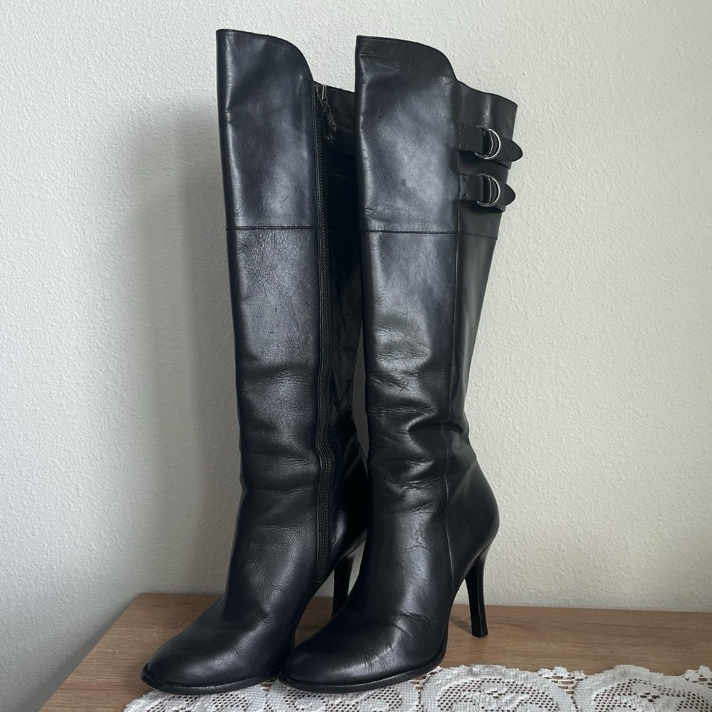 Knee length black leather boots